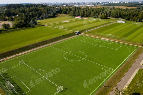 Preview: Top view of a football field with green grass outdoors in summer