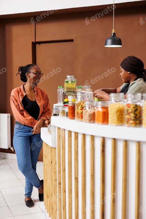 Preview: Vendor checks out groceries at desk
