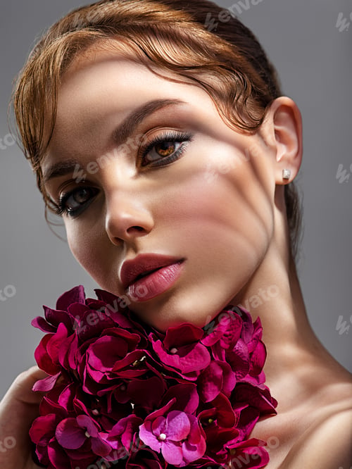 Preview: Beautiful white girl with purple flowers. Stunning brunette girl with big violet bouquet flowers.