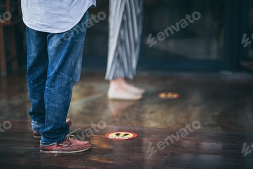 Preview: red round sign printed on ground at the font of cafe