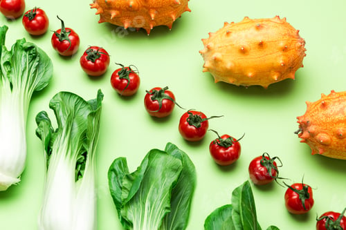 Preview: Fruits and Vegetables Patter. Flat Lay on Green Background. Raw Food Geometric Background