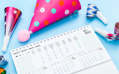 Preview: Desktop paper calendar for March 2022 with birthday set on a light blue background.