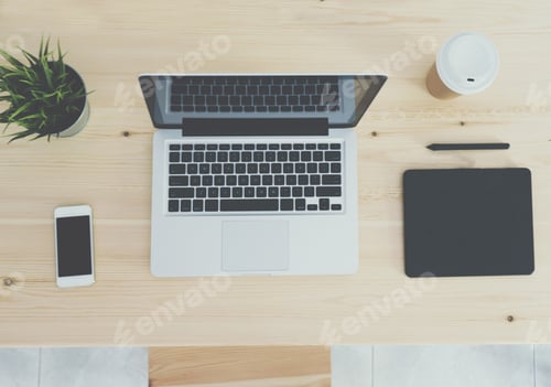 Preview: Top view of wooden workplace with coffee, laptop