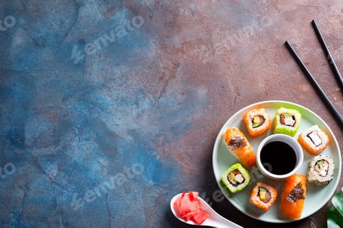 Preview: Various Fresh and delicious sushi set on ceramic plate with slate sticks, sauce on stone background
