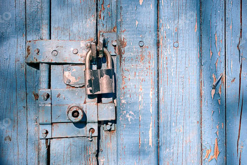 Preview: locked latch and padlock on old door
