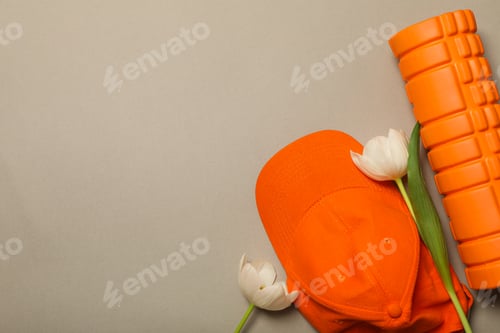 Preview: Sportswear with flowers on an orange background.