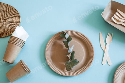 Preview: Eco-friendly disposable utensils made of bamboo wood and paper on a trending background.