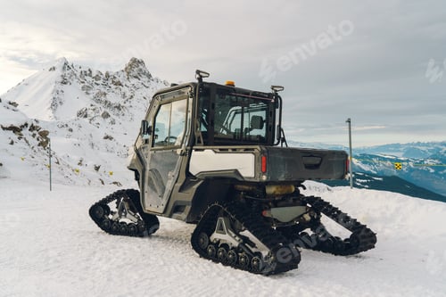 Preview: Tracked utility vehicle exploring snow covered mountain terrain in Davos Klosters