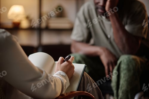 Preview: Mental Health Specialist Taking Notes at Session with Black Veteran
