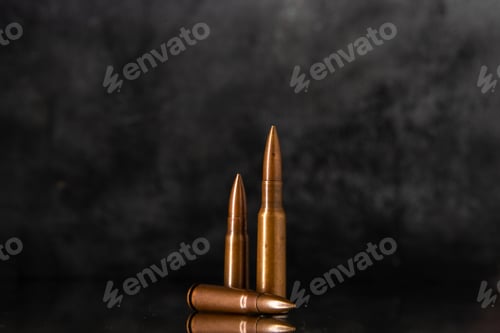 Preview: front view of brown bullets on gray background gun tank war shooting