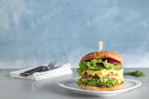 Preview: Plate with tasty burger on table against color background. Space for text