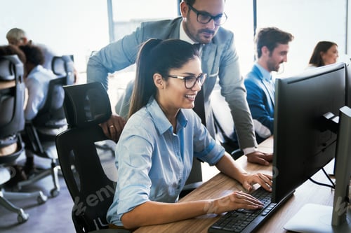 Preview: Happy business people having fun and chatting at workplace office