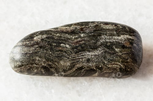 Preview: sample of tumbled phyllite rock on white marble