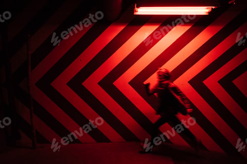 Preview: Blurred man figure on underground walkway