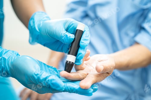 Preview: Doctor check diabetes from finger blood sugar level with finger lancet.
