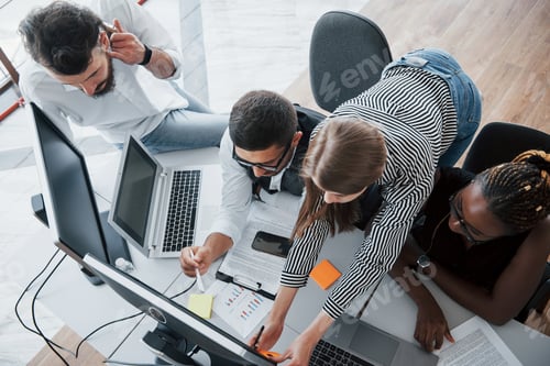 Preview: A group of multinational busy people working in the office