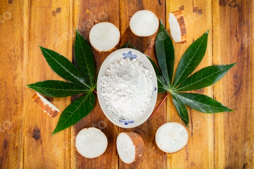 Preview: pile of cassava, cassava and cassava flour on a background of rustic wood (Manihot esculenta)