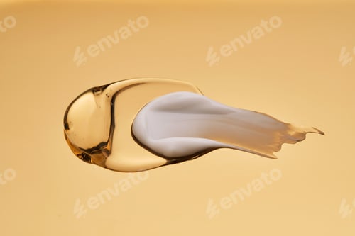 Preview: Creamy Cosmetic Swatches Against Soft Gold Backdrop