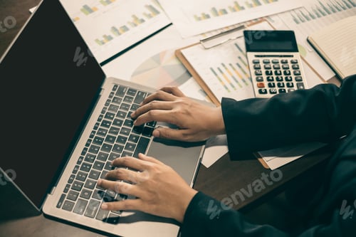 Preview: businesswoman sit at their desks and calculate financial graphs showing results about their