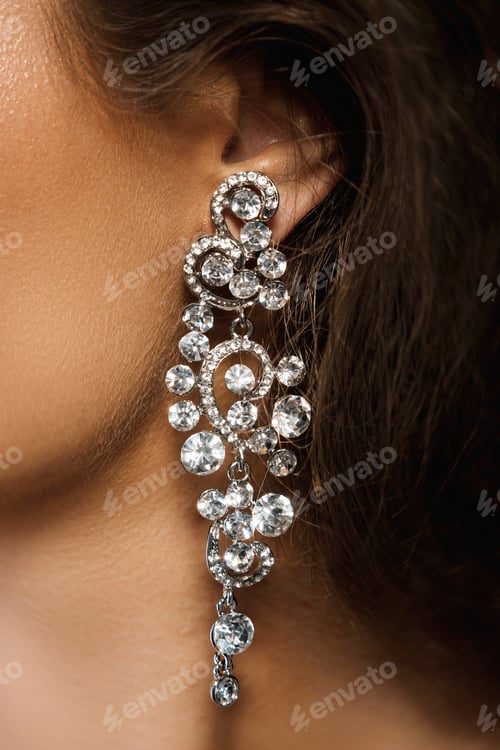 Preview: Ear and beautiful big earring with a lot of gemstones