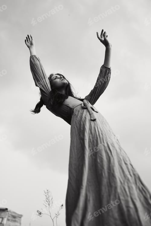 Preview: beautiful woman in dress dramatic style emotions posing black and white photo