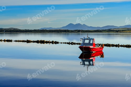 Preview: Small red boat in peaceful harbour