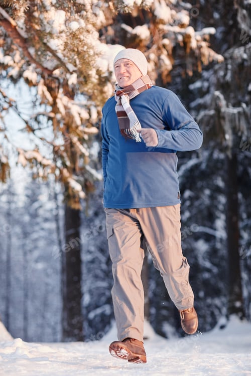Preview: Senior Man Running in Winter Forest