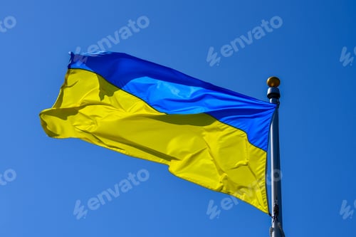 Preview: Ukrainian flag waving in the wind on a bright, sunny day.