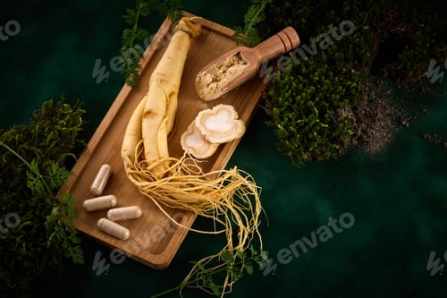 Preview: Ginseng Root and Supplements on a wooden tray with green foliage background.
