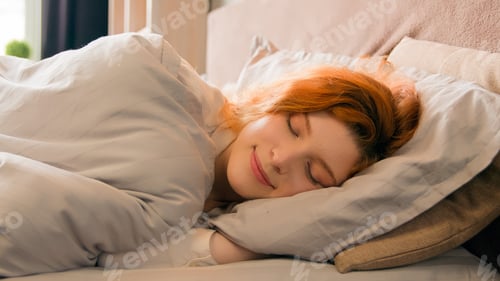 Preview: Caucasian happy woman sleeping in comfortable cozy bed at home girl lady asleep lying on soft pillow