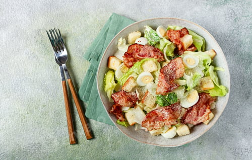 Preview: caesar salad with fried bacon, quail eggs, homemade, no people,