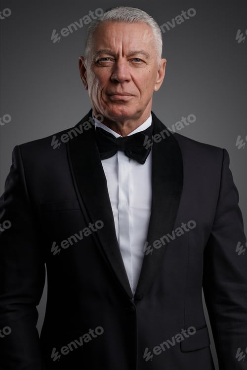 Preview: The distinguished old man stands confidently in a black suit and bow tie