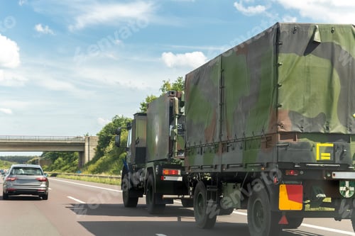 Preview: German armoured semi-trailer cargo truck carrier drives military convoy highway road. ALLIANCE