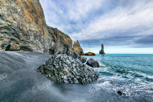 Preview: Breathtaking view of rock formations Troll Toes on Black beach Reynisfjara near the village of Vik.