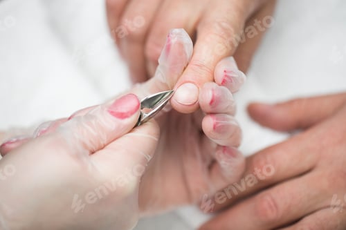 Preview: Close-up Of A Manicurist Cutting Off The Cuticle From The Person's Fingers