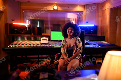 Preview: Portrait of a young musician sitting in a recording studio.
