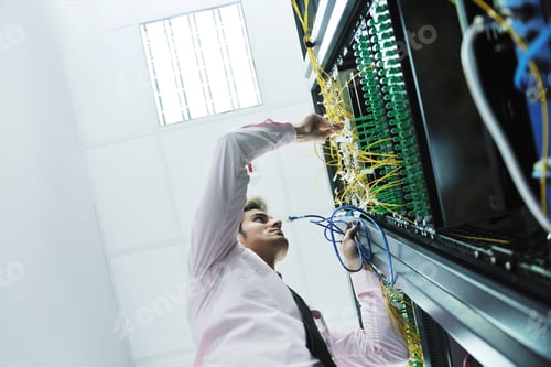 Preview: Young Handsome Business Man Engeneer In Datacenter Server Room