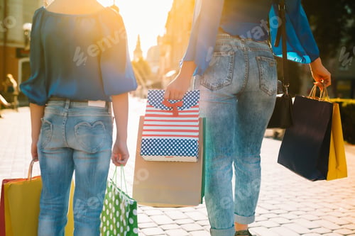 Preview: sale, consumerism, money and people concept - happy young woman with shopping bags