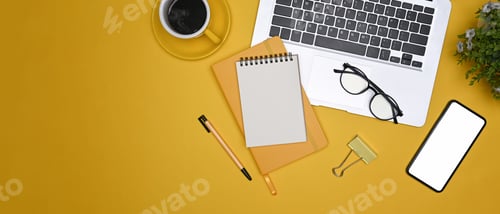 Preview: Top view stylish workplace with laptop computer, mobile phone, notebooks and coffee cup.