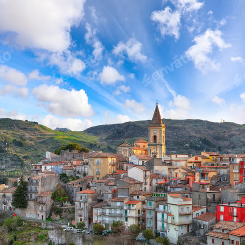 Preview: Amazing Panorama of the belltower and the village in the valley at early sunrise.