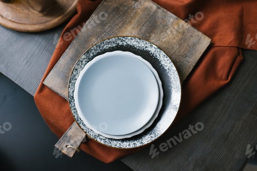 Preview: Plate with a White Plate on Top of it is on a Wooden Board