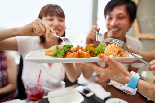 Preview: Group of friends sharing a meal.