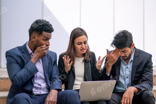 Preview: Multiethnic group of happy business people working together