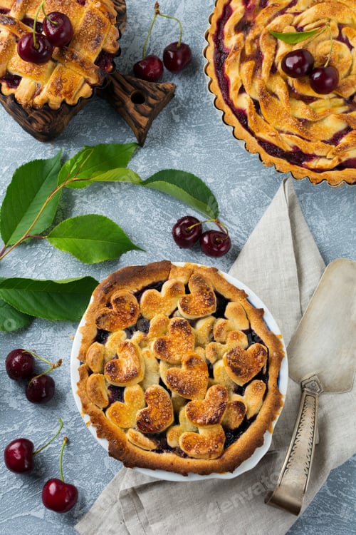 Preview: Homemade open cherry pie with lattice on a gray concrete background. Selective focus. Top view