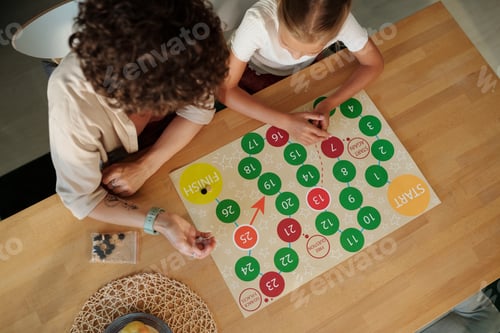 Preview: Above angle of young woman throwing dice over paper with circles