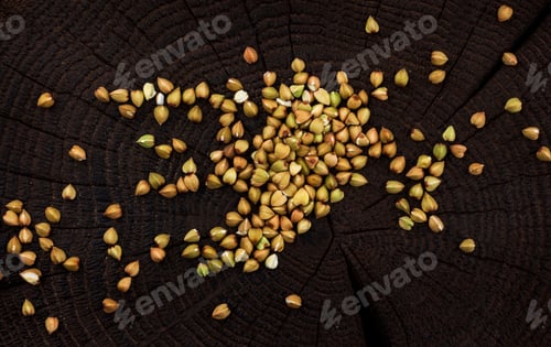 Preview: Green buckwheat on black wooden background. Top view