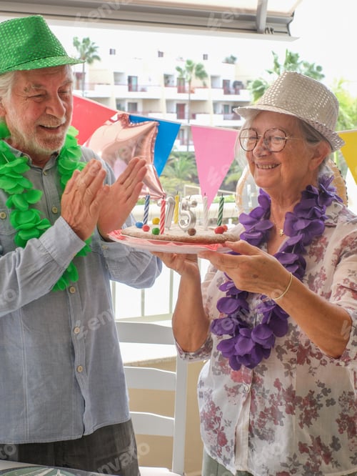 Preview: Joyful elderly couple celebrates a 75 birthday in a festive and colorful setting.