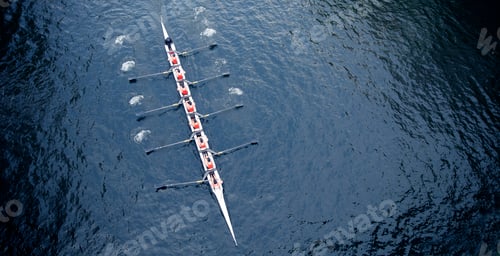 Preview: High angle view of Eight rowing on river.