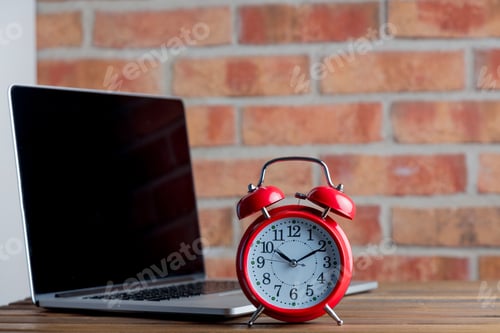 Preview: Alarm clcok and laptop