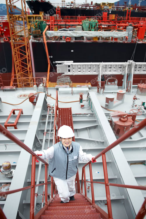 Preview: Portrait of worker on steps at shipping port, elevated view, GoSeong-gun, South Korea